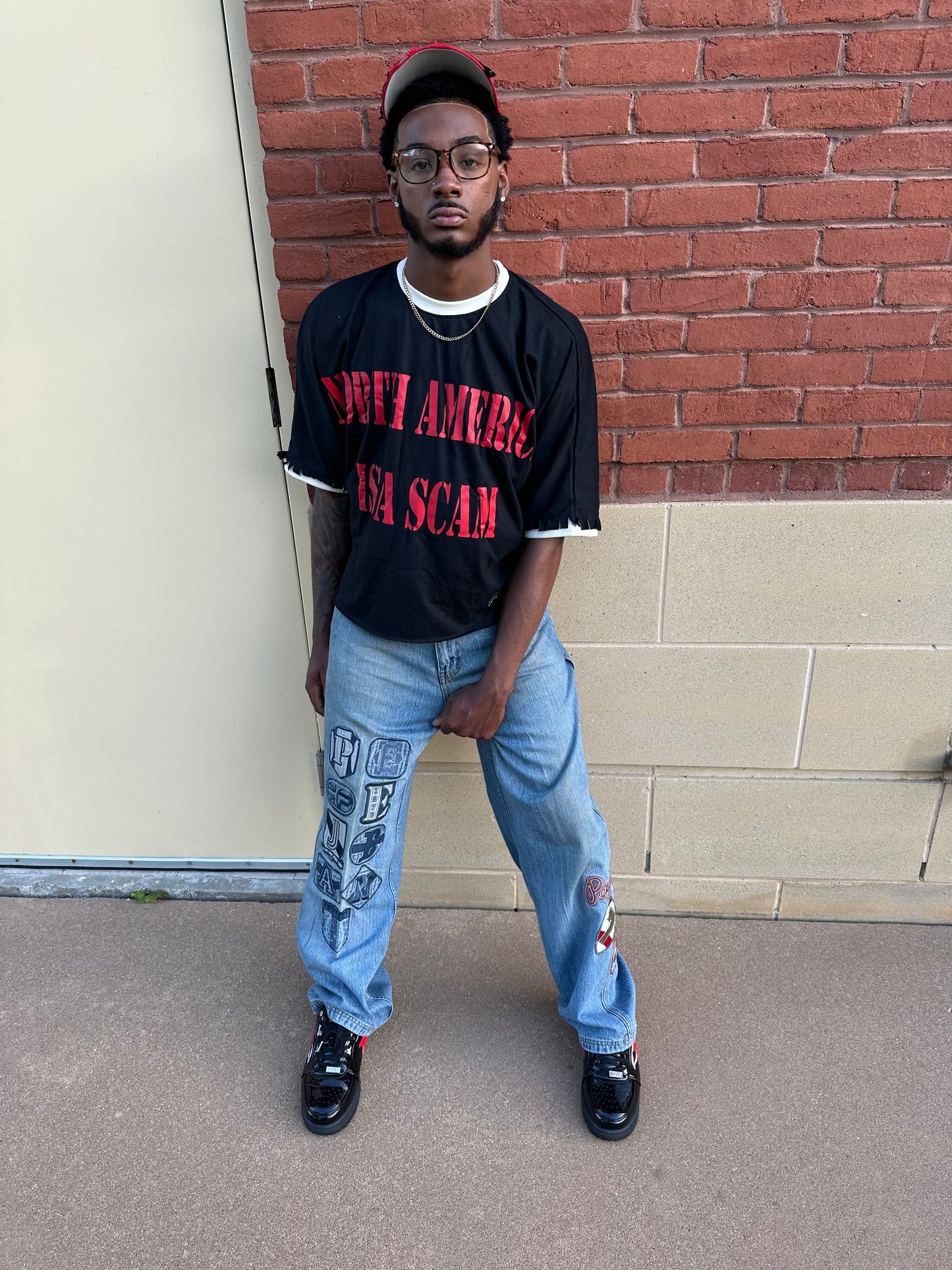“NA IS A SCAM ” T-Shirt