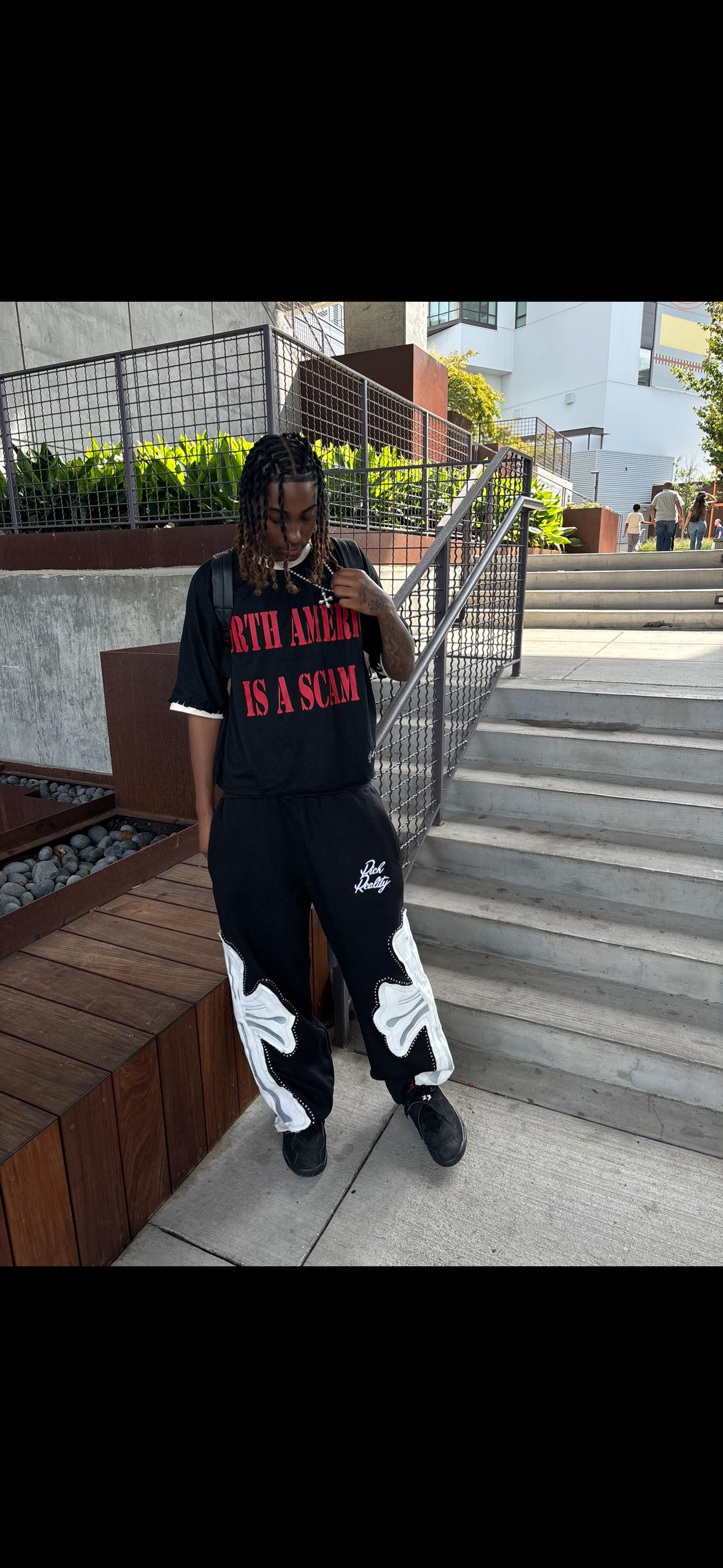 “NA IS A SCAM ” T-Shirt